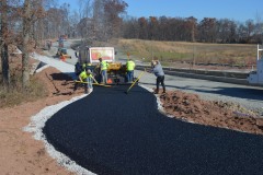 Workers performing commercial paving on site in Frederick, MD