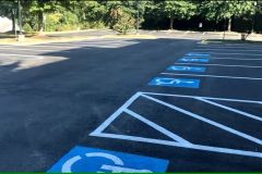Commercial parking lot with fresh protective asphalt coating in Frederick, MD