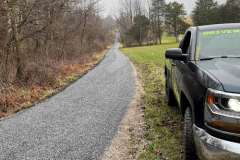 Smooth and long-lasting chip-seal road surface completed with tar and stone in Frederick, MD